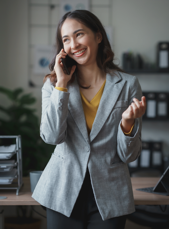 Smiling businesswoman talking on the phone, providing professional insurance support